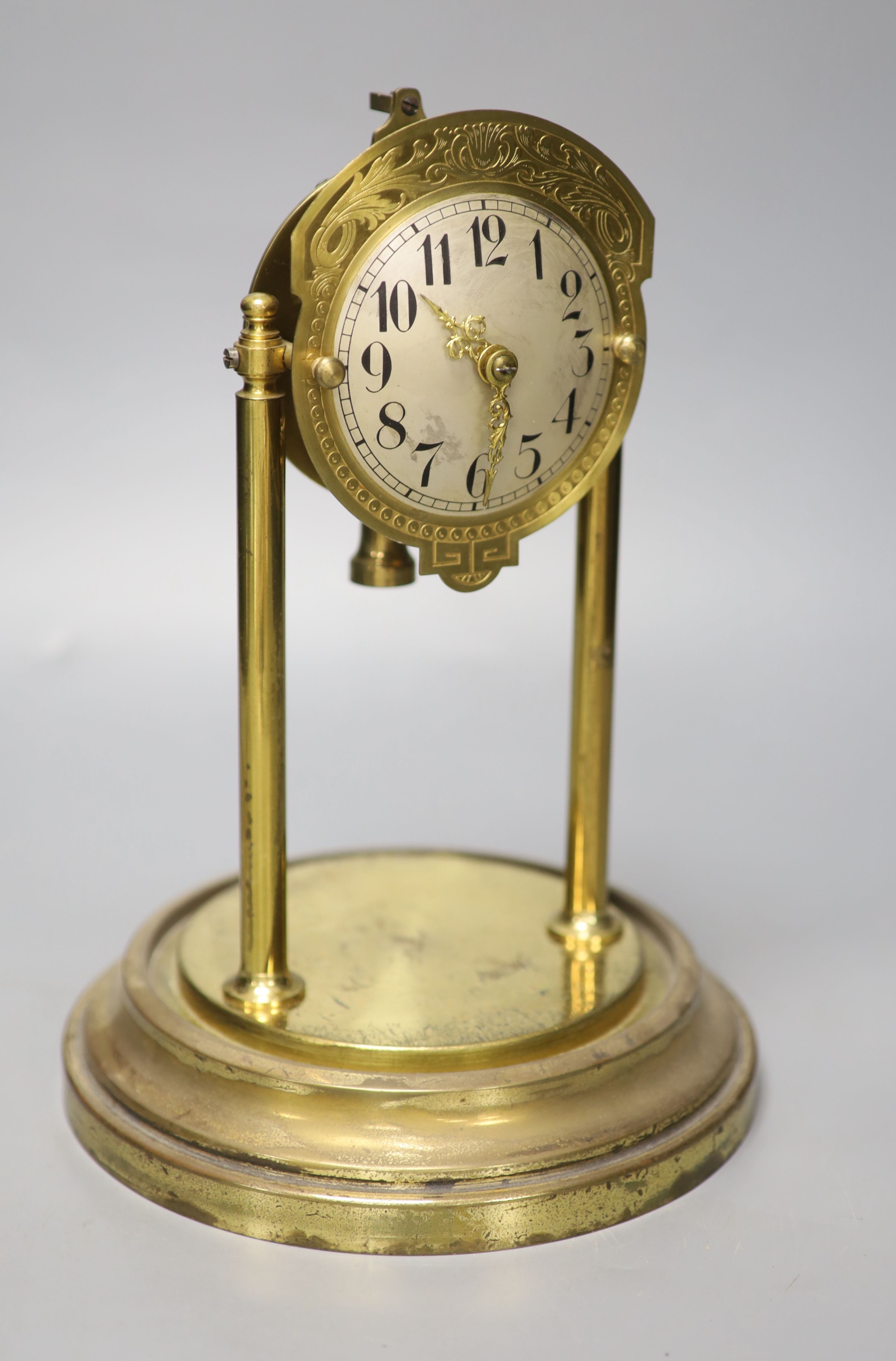 A brass electric mantel clock, under a glass dome, overall height 30cm